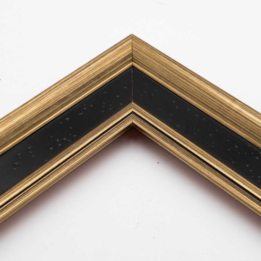 Corner detail of the black-and-gold Prestige frame's substantial moulding